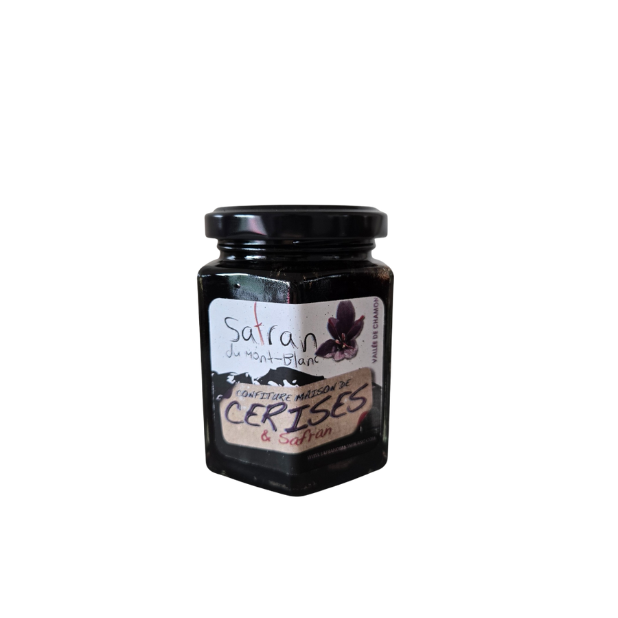 Jar of cherry jam with a label on a white background