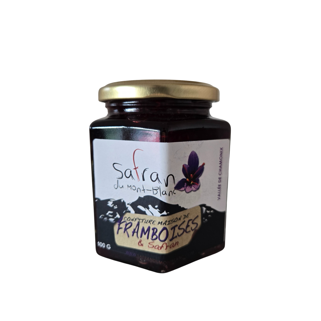 Jar of raspberry jam with a visible brand label on a white background